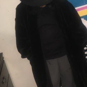 Long reversible black faux fur coat